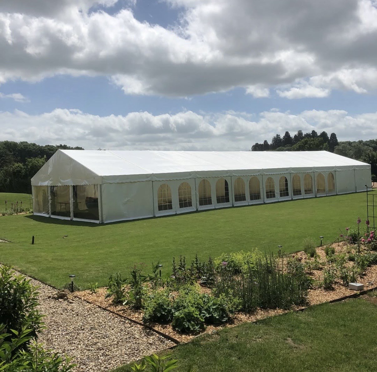 Large outdoor event marquee on lawn